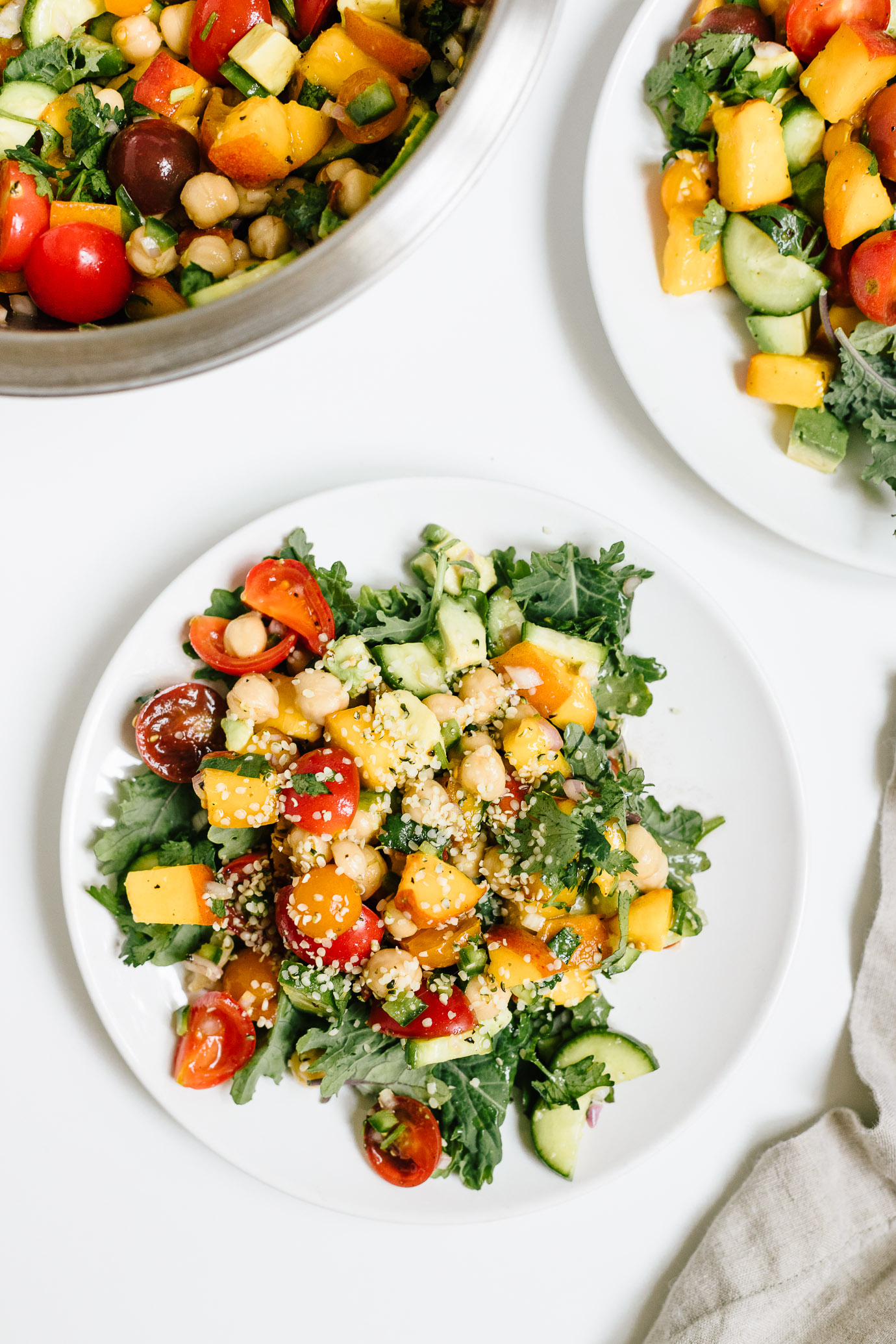 spicy tomato peach salad with chickpeas and hemp seeds