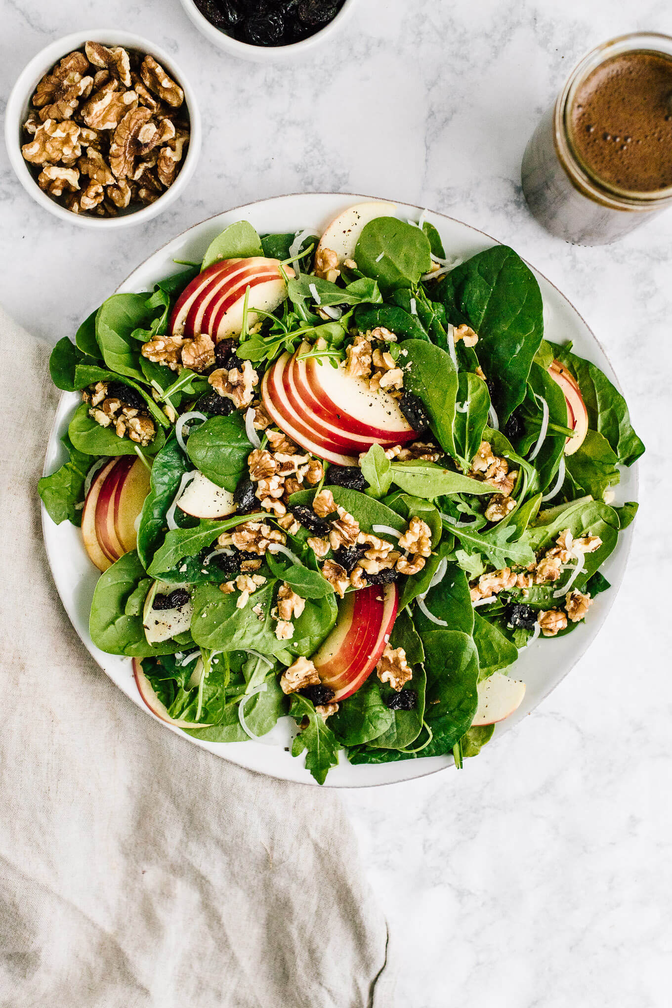 Apple Walnut Spinach Salad with Balsamic Vinaigrette in serving bowl