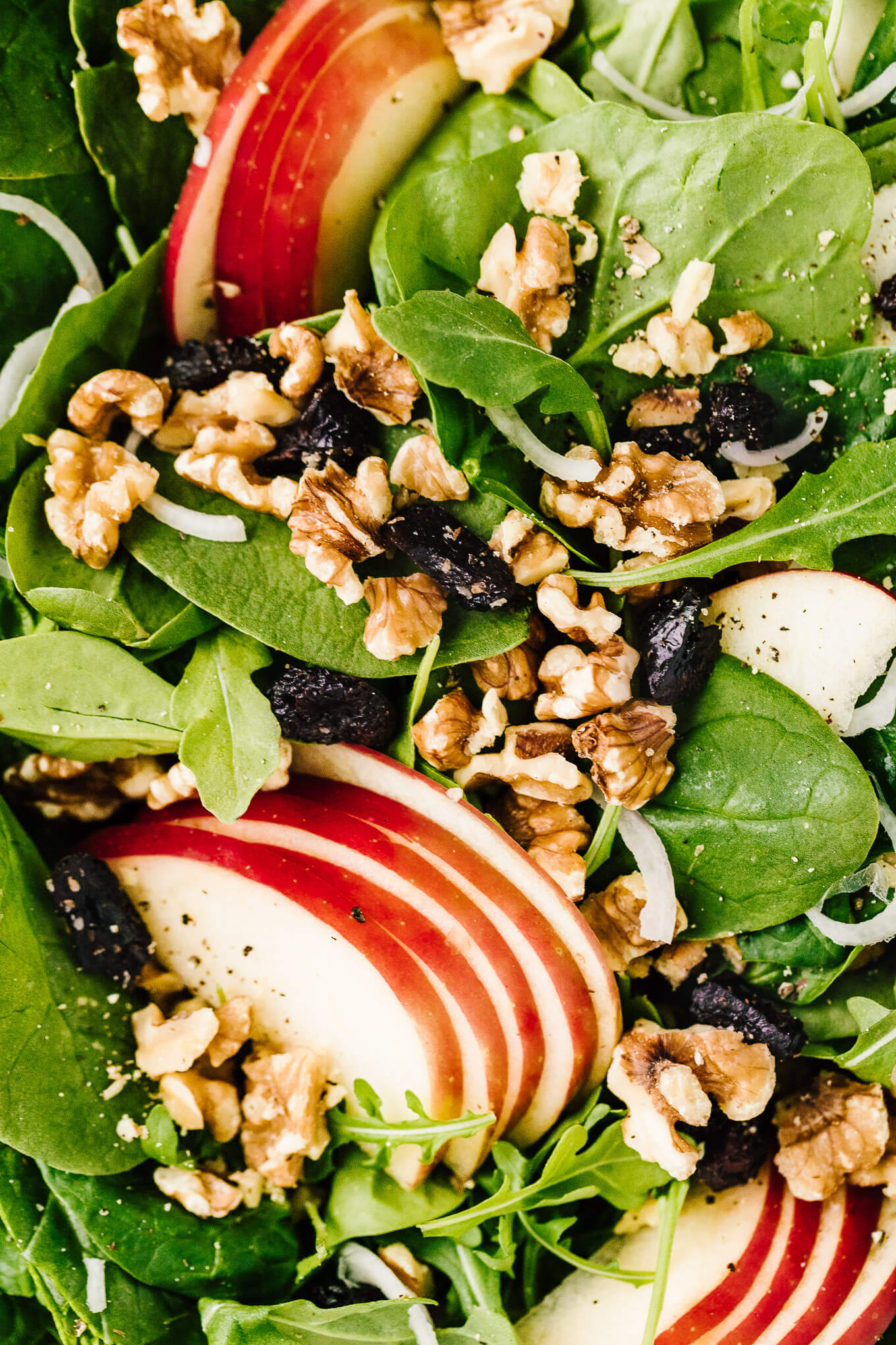 close up Apple Walnut Spinach Salad with Balsamic Vinaigrette