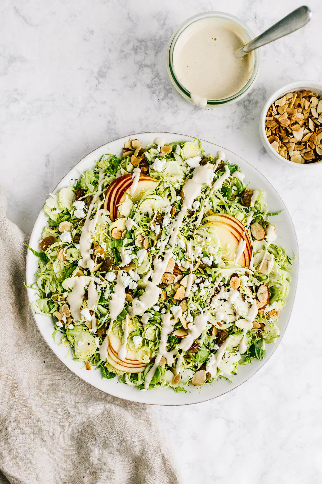 Shaved Brussels sprout and apples salad with maple tahini dressing