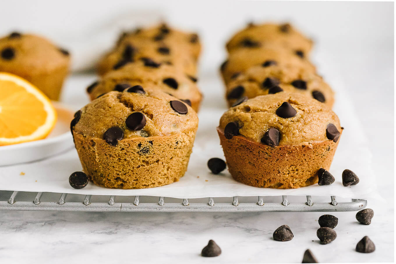 gluten-free orange chocolate chip muffins on cooling rack