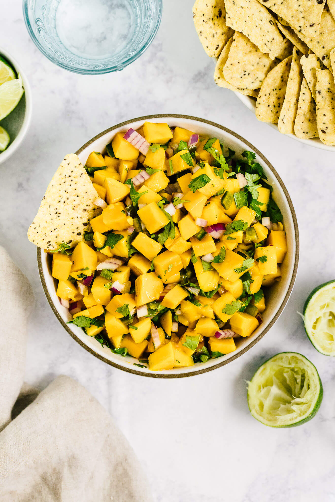 Fresh mango salsa - this 5 ingredient recipe makes for a healthy summer dip.