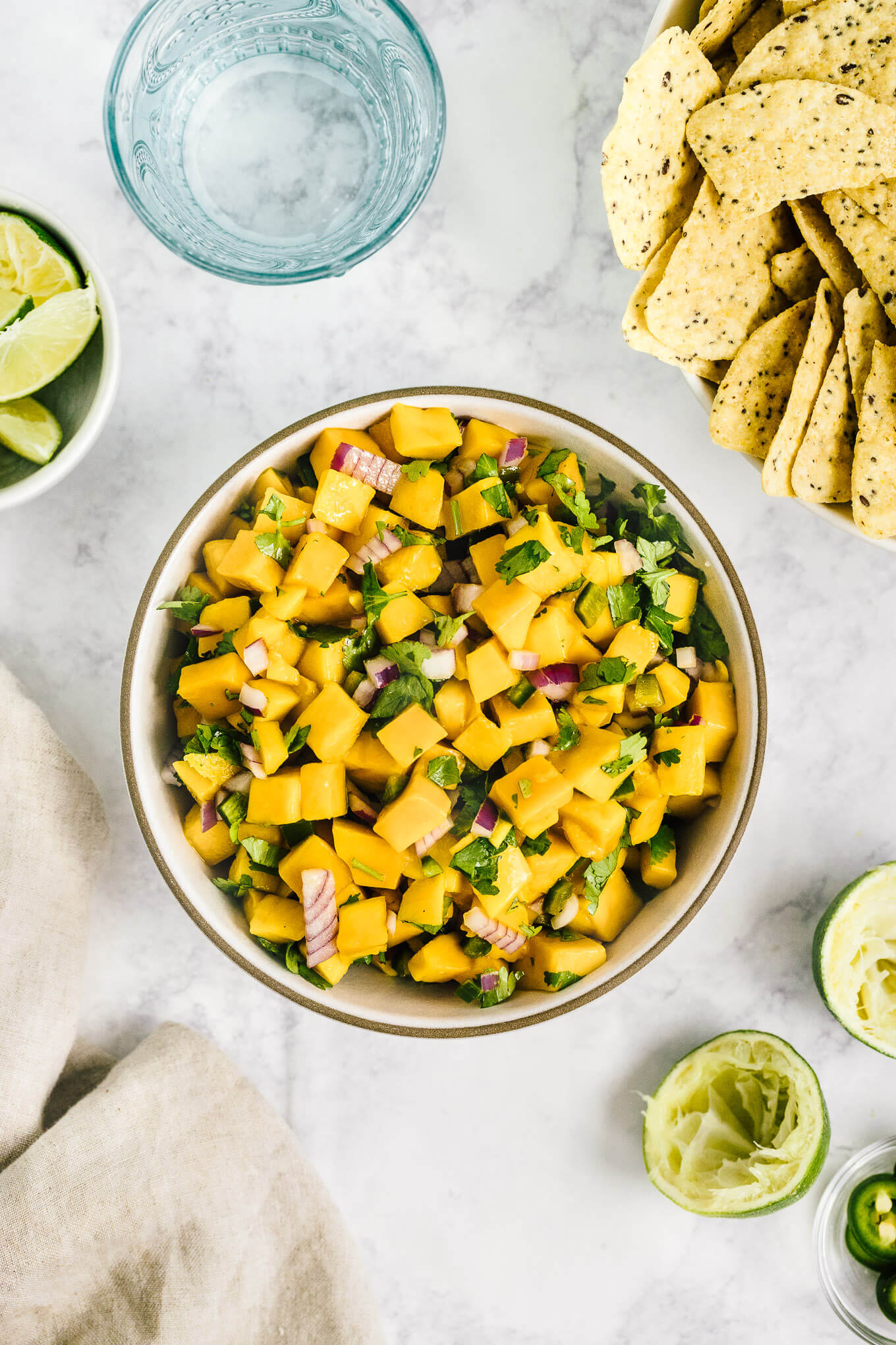 Fresh mango salsa - this 5 ingredient recipe makes for a healthy summer dip.