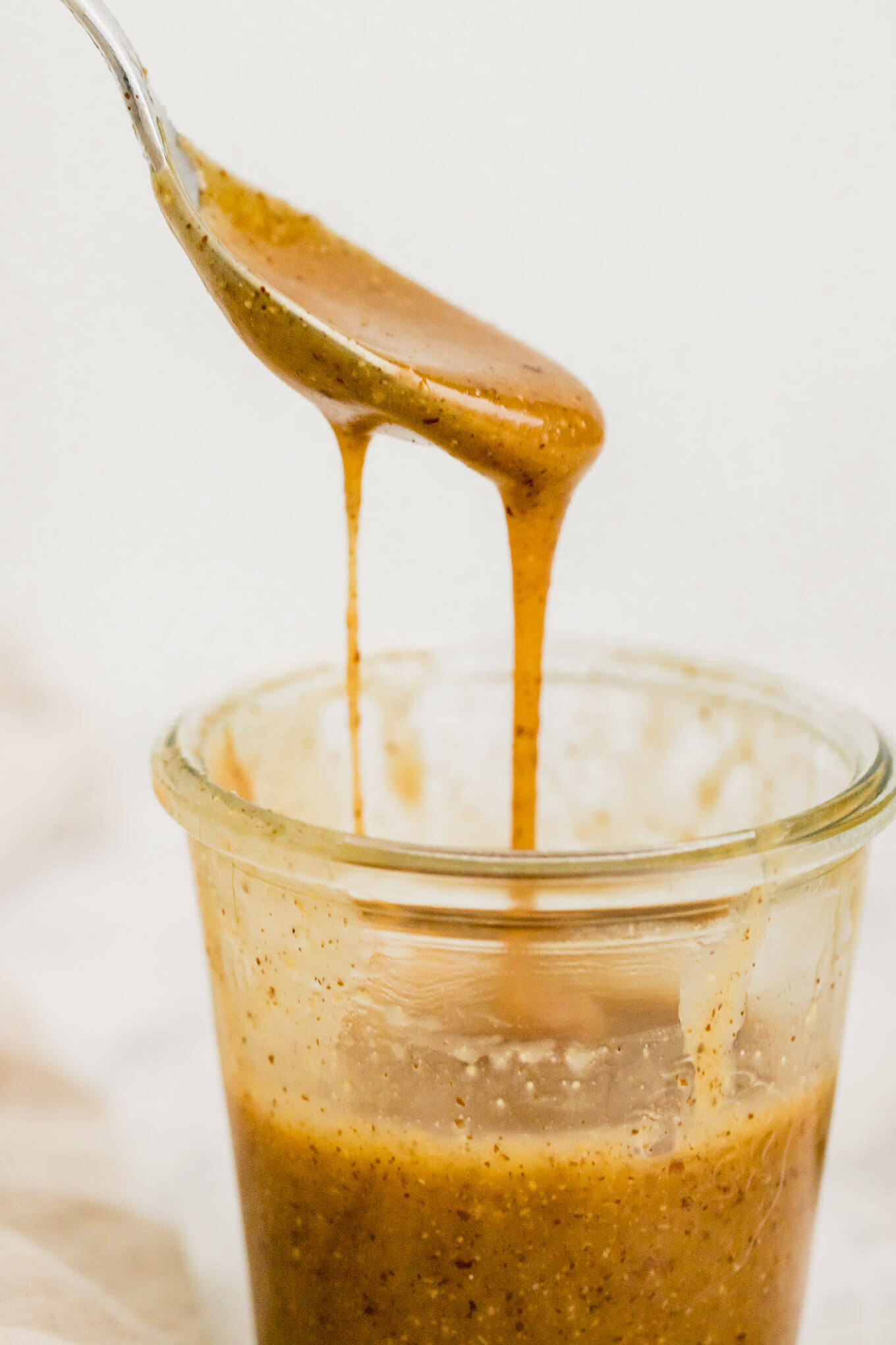 Easy 5-minute vegan caramel sauce made with almond butter, coconut oil, vanilla and salt.