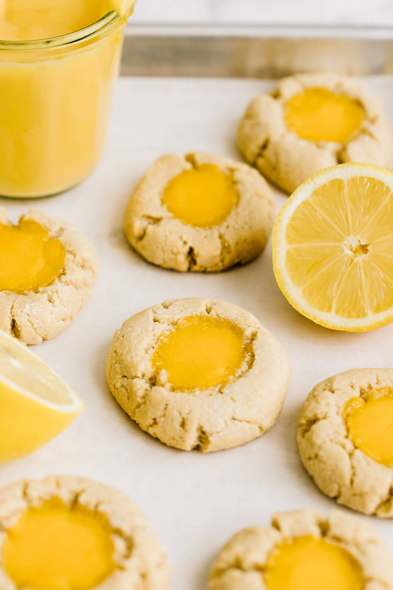 grain-free lemon thumbprint cookies made with almond flour and lemon curd.