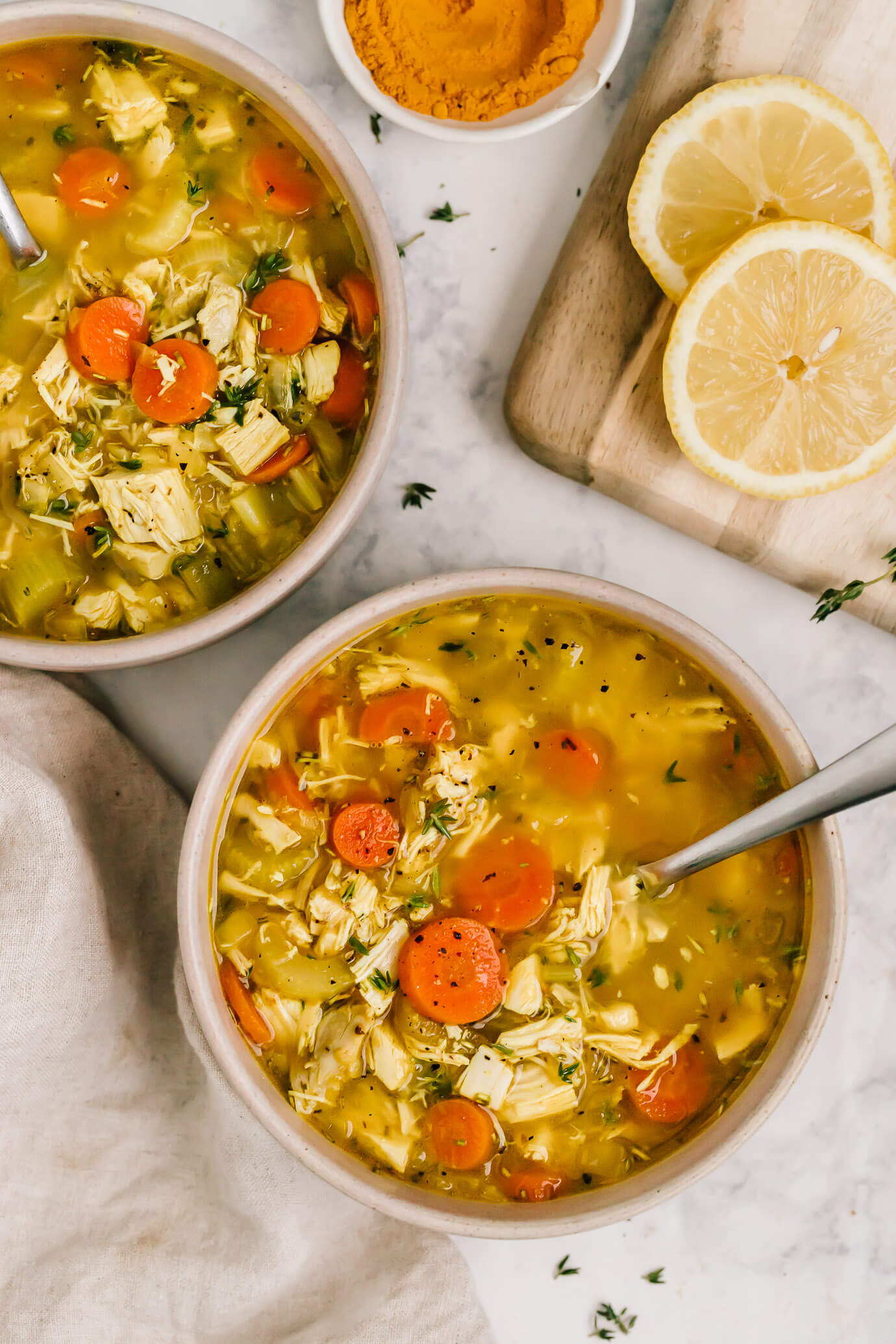 A nourishing chicken soup with no noodles that comes together quickly using rotisserie chicken. It's a veggie-loaded chicken no noodle soup with herbs and a touch of turmeric and lemon. Grain-free, Gluten-free and paleo friendly.