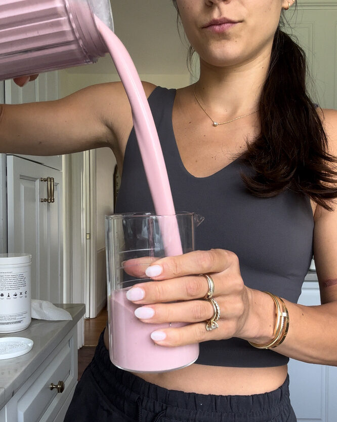 Strawberry Probiotic Smoothie pouring into glass